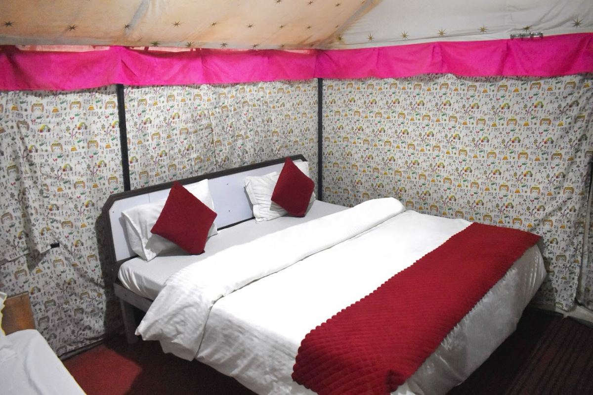 Cozy tent bedroom with red accents