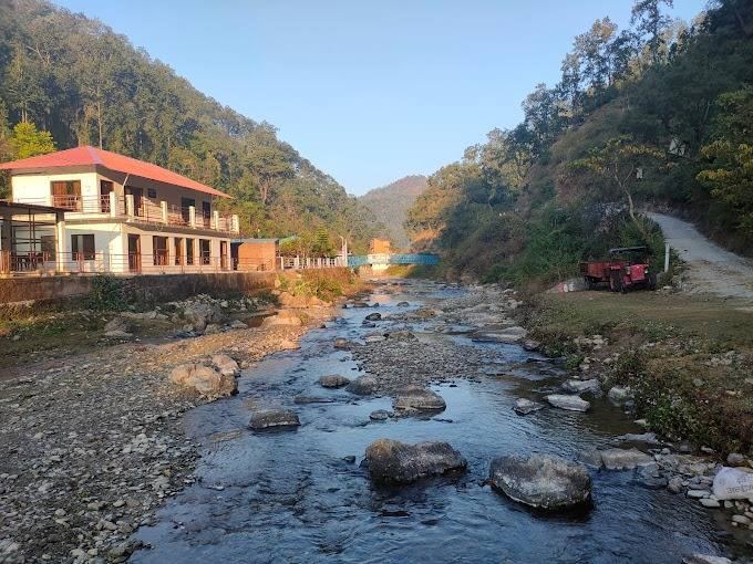 Riverside lodge beside the stream