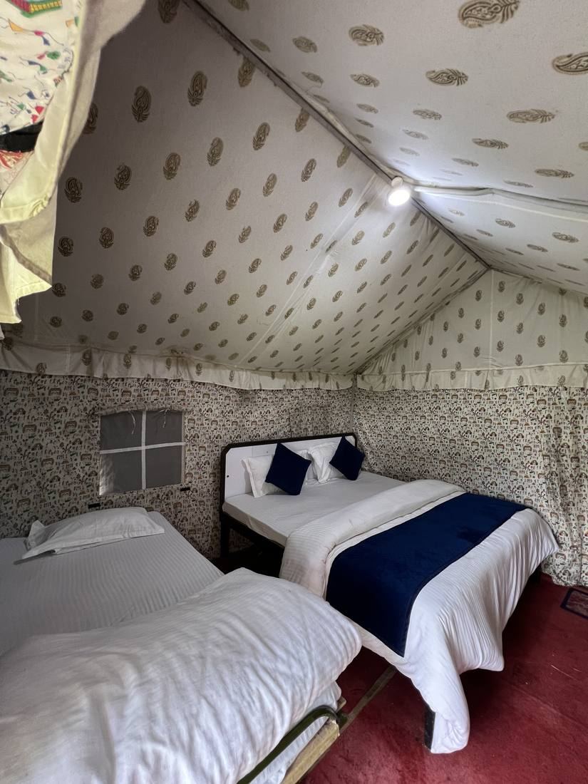 Twin beds inside a block-print tent